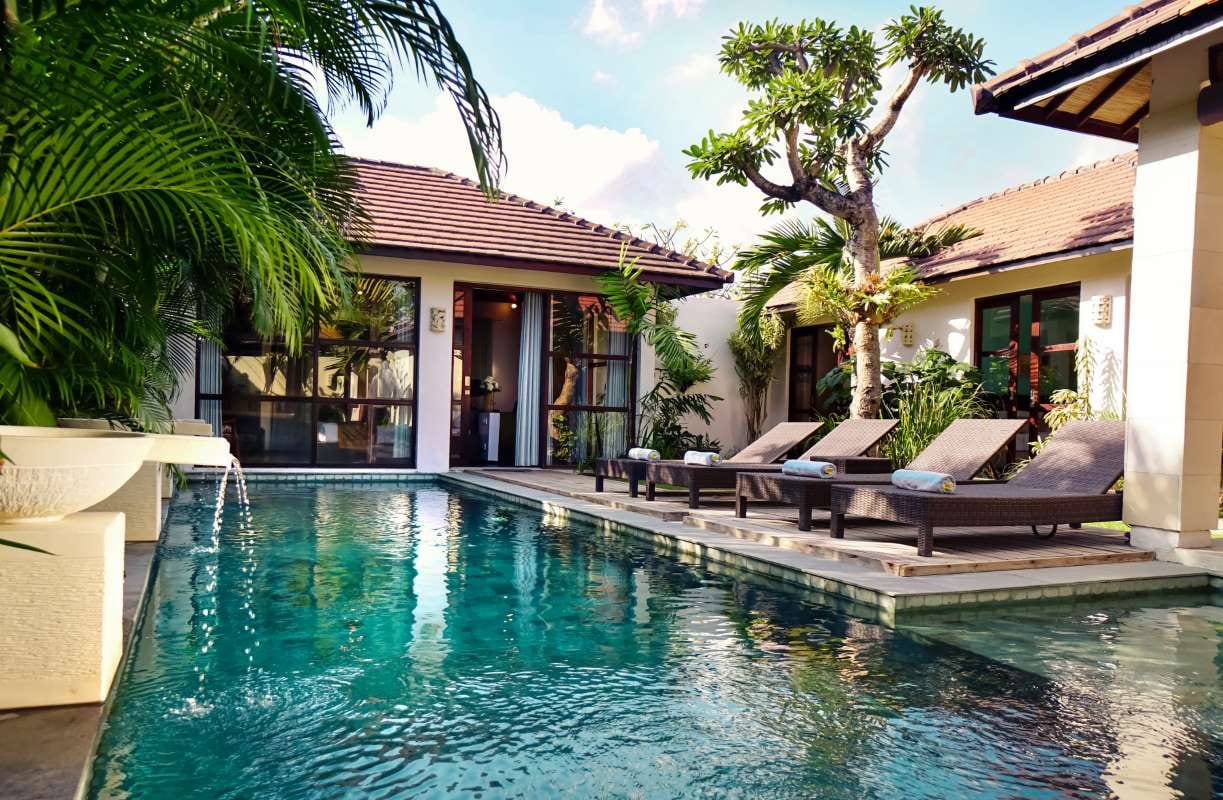 Contemporary home with tropical pool and landscaped garden, matching pool service routing topic