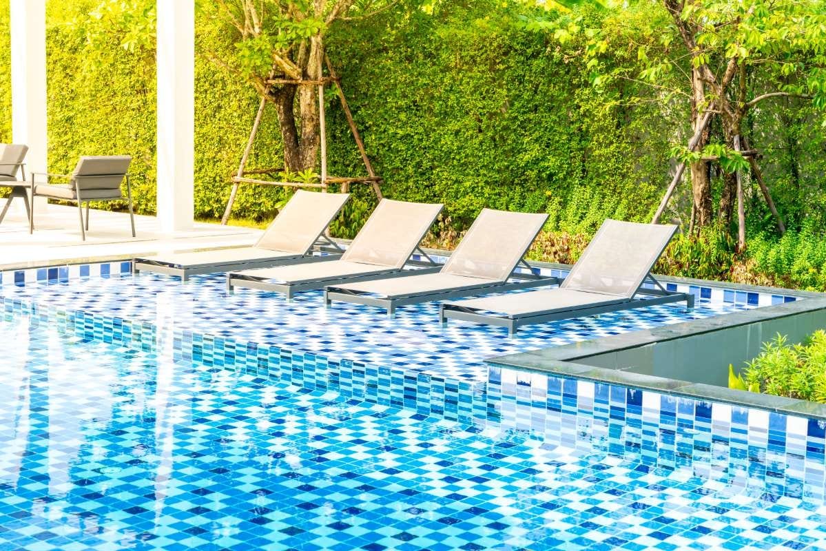 Outdoor pool and lounge area at a hotel resort