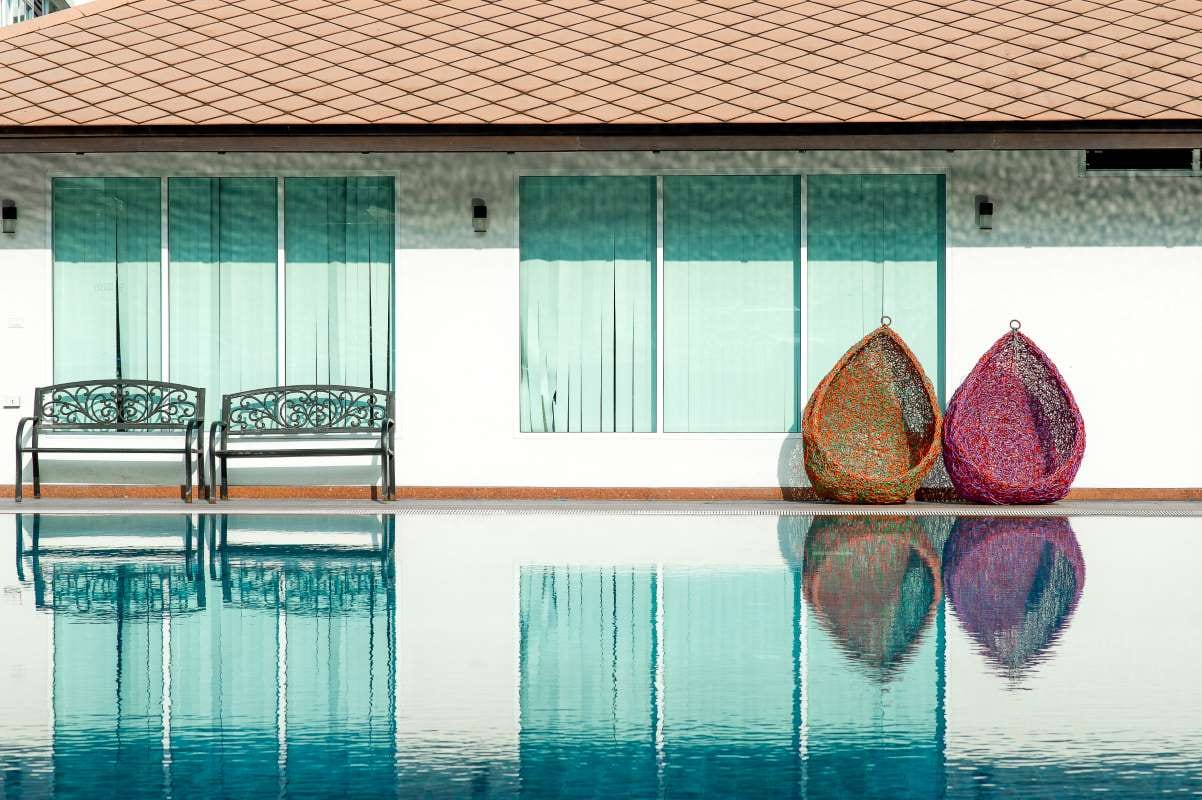Blue swimming pool with copy space on a hot day
