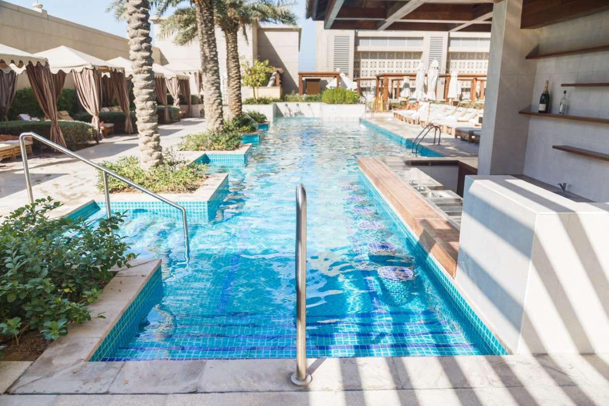 Clear blue pool water for seasonal pool service adjustments