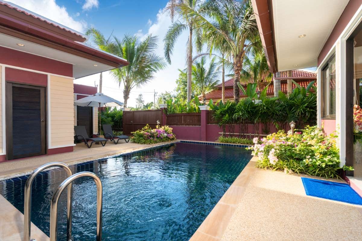 Luxury villa exterior with a modern pool, reflecting AI-driven business insight and strategy