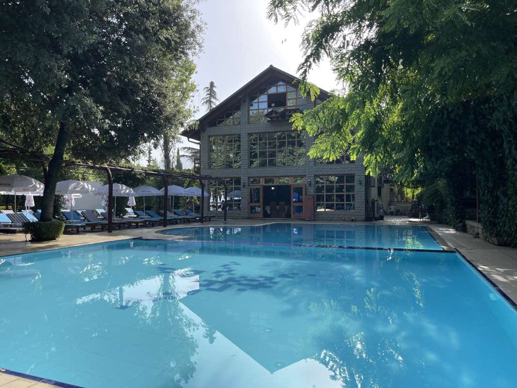 House with pool house and “pool side” words, tied to pool service careers