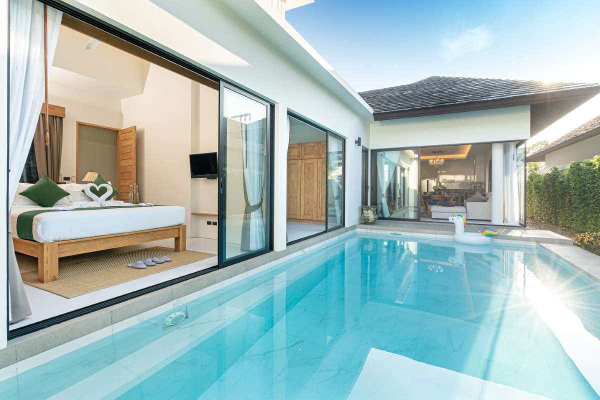 Luxury villa with a swimming pool overlooking a landscaped patio