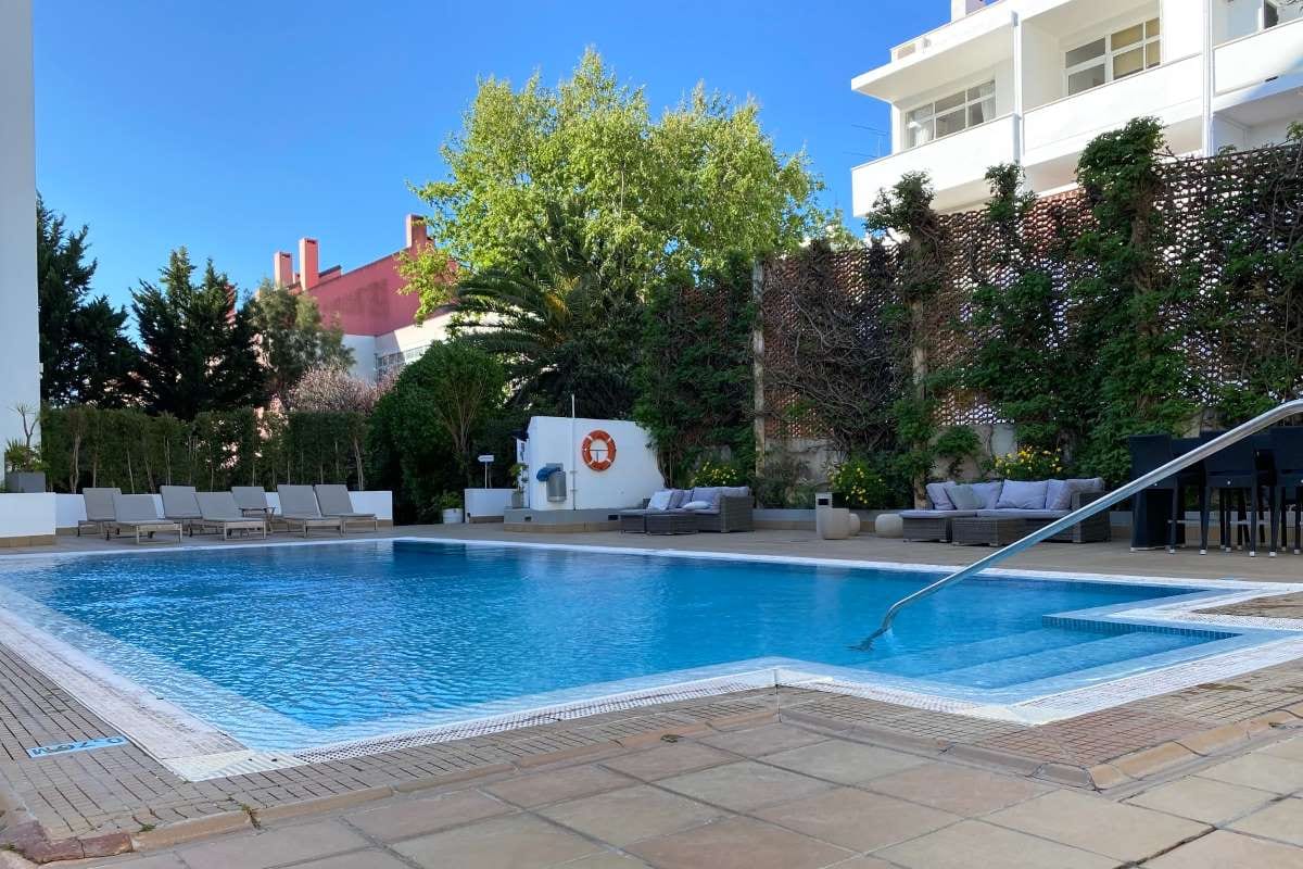 Sunny private home pool yard on a bright day