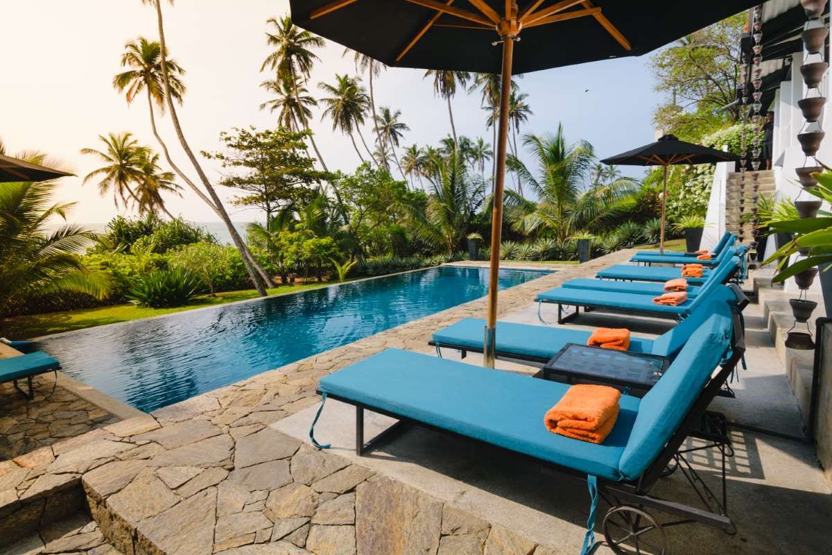 Swimming pool with a beach-style view and calm waterline